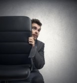 23909539-concept-of-fear-of-a-businessman-behind-a-chair